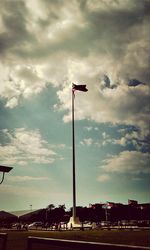 Low angle view of floodlight against sky