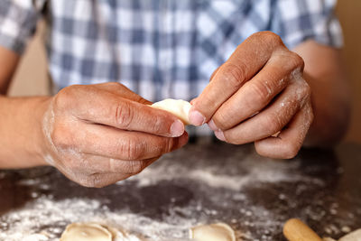 Close-up of man preparing food