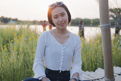 Portrait of teenage girl standing on field