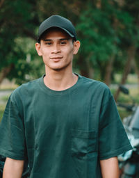 Portrait of young man standing outdoors