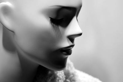 Close-up of mannequin against gray background