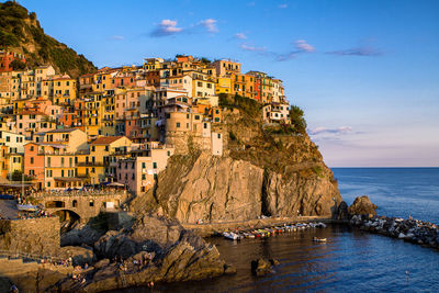 Panoramic view of sea and buildings against sky