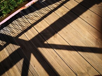 High angle view of shadow on footpath