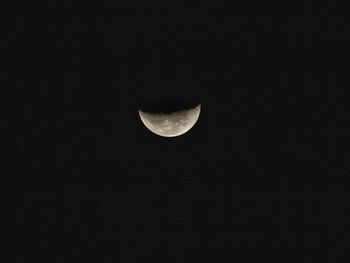 Low angle view of moon against clear sky at night