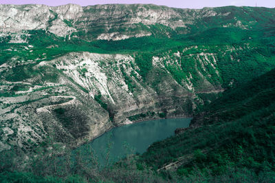 High angle view of lake by mountain