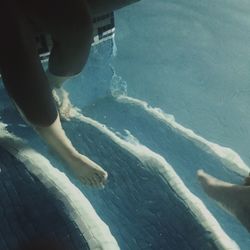 Low section of woman in swimming pool