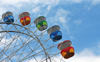 Low angle view of ferris wheel against sky