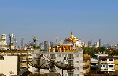 Bangkok skyline with phu khao thong of wat saket temple, thailand