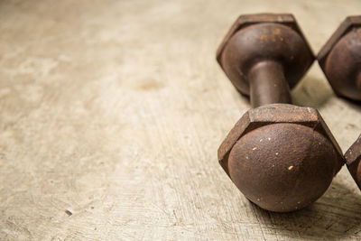 High angle view of metallic dumbbells on floor