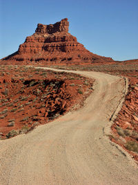 Dirt road against valley of the gods