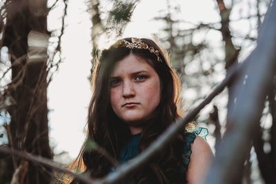 Portrait of young woman in forest