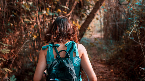 Rear view of woman in forest