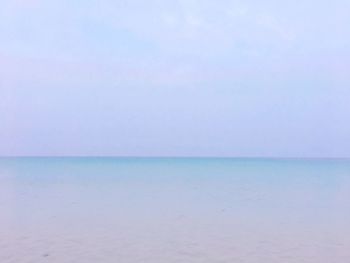 Scenic view of sea against blue sky