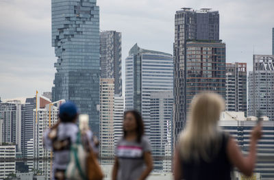 Rear view of man looking at cityscape