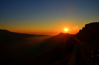 Silhouette of mountain against sky during sunset