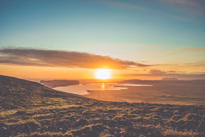 Scenic view of landscape against sky during sunset