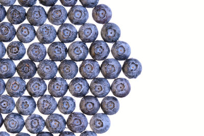 Close-up of blueberries against white background