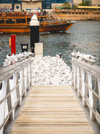 Pier on sea by restaurant