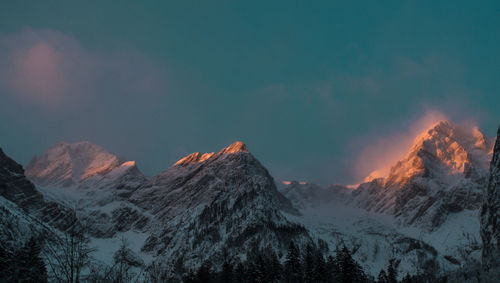 Scenic view of snowcapped mountains during winter