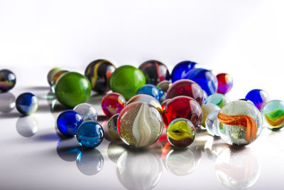 Close-up of colorful objects on white background