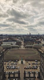 High angle view of city against cloudy sky