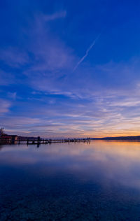 Scenic view of sea against sky at sunset