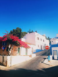 Built structures against clear blue sky