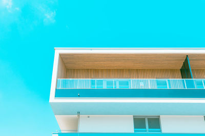 Low angle view of building against clear blue sky