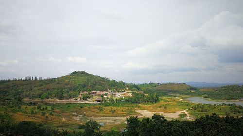 Scenic view of agricultural landscape against sky