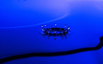 Close-up of water over blue background