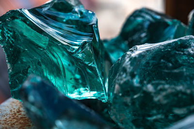 Close-up of blue glass on table