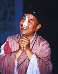 Portrait of smiling man against gray background