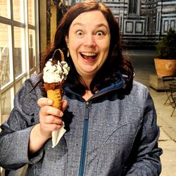 Portrait of smiling woman holding ice cream