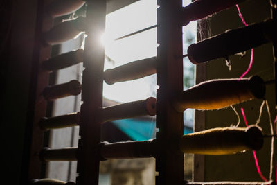 Close-up of railing against window