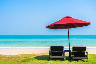 Lifeguard chair on beach against clear sky