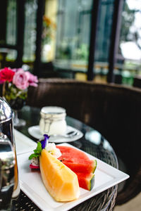 Close-up of fruits served in plate on table