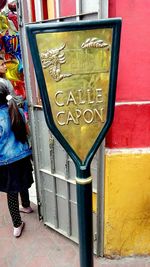 High angle view of text on footpath