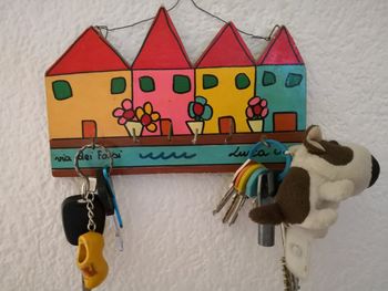 Close-up of stuffed toy hanging on wall