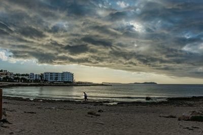 Scenic view of sea against cloudy sky