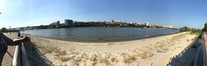 Panoramic view of beach against blue sky