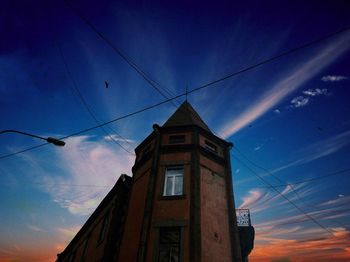 Low angle view of building against blue sky