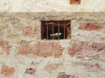 Low angle view of weathered wall of old building