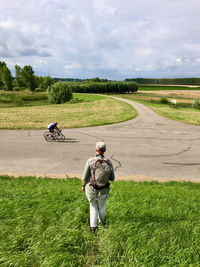 Man riding motorcycle on field