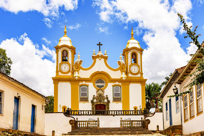 Low angle view of historic ancient church against cloudy sky at tiradentes, minas gerais 