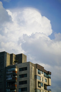 Low angle view of modern buildings against sky