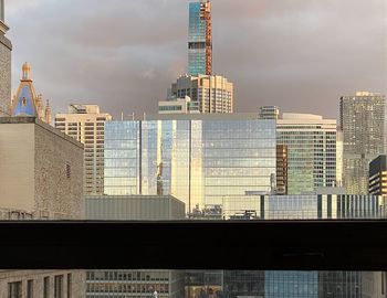 Modern buildings in city against sky