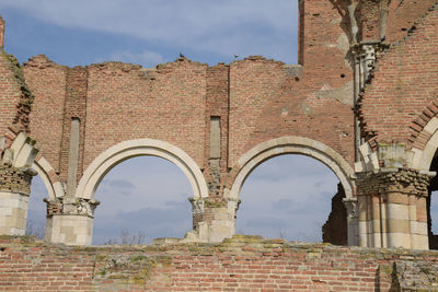 Low angle view of old building against sky