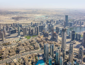 High angle view of city buildings against sky