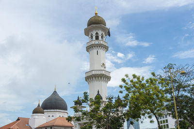 Low angle view of bell tower against sky