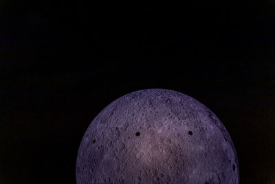 Low angle view of moon against sky at night